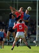 9 April 2000; Nicholas Murphy of Cork in action against Senan Connell, left, and Jason Ward of Dublin as Ciaran O'Sullivan of Cork looks on during the Church & General National Football League Division 1A match between Dublin and Cork at Parnell Park in Dublin. Photo by Brendan Moran/Sportsfile