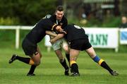 22 April 2000; Eamonn Buckley of Young Munster is tackled by Buccaneers pair Des Rigney and Donal Rigney during the AIB All-Ireland League Division 1 match between Young Munster and Buccaneers at Tom Clifford Park in Limerick. Photo by Ray Lohan/Sportsfile