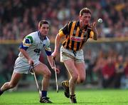 12 March 2000; Eamonn Kennedy of Kilkenny in action against Ken McGrath of Waterford during the Allianz National Hurling League Division 1B Round 3 match between Kilkenny and Waterford at Nowlan Park in Kilkenny. Photo by Ray McManus/Sportsfile