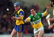2 April 2000; Eamonn Taffe of Clare is tackled by Johnny Pilkington of Offaly during the Church & General National Hurling League Division 1A Round 5 match between Offaly and Clare at St Brendan's Park in Birr, Offaly. Photo by Aoife Rice/Sportsfile