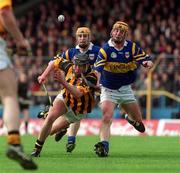 26 March 2000; Eddie Brennan of Kilkenny in action against Paul Ormonde of Tipperary during the Church & General National Hurling League Division 1B Round 4 match between Tipperary and Kilkenny at Semple Stadium in Thurles, Tipperary. Photo by Ray Lohan/Sportsfile