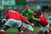 31 March 2000; Emmet Farrell of Ireland  is tackled by Andrew Newman, left, and Iestyn Thomas during the Six Nations A Rugby Championship match between Ireland and Wales at Donnybrook Stadium in Dublin. Photo by Matt Browne/Sportsfile