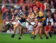 14 September 1997; Eugene O'Neill of Tipperary in action against against Anthony Daly and Brian Lohan of Clare during the Guinness All-Ireland Hurling Championship Final match between Clare and Tipperary at Croke Park in Dublin. Photo by Matt Browne/Sportsfile