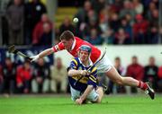 2 April 2000; Eugene O'Neill of  Tipperary in action against Mark Landers of Cork during the Church & General National Hurling League Division 1B match between Cork and Tipperary at Páirc Uí Chaoimh in Cork. Photo by Brendan Moran/Sportsfile