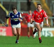 12 March 2000; Fergal Ryan of Cork in action against Cyril Cuddy of Laois during the Church & General National Hurling League match between Cork and Laois at Pairc Ui Chaoimh in Cork. Photo by Brendan Moran/Sportsfile