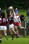 29 April 2000; Kieran Fitzgerald of Galway in action against Kevin Hughes of Tyrone during the All-Ireland Under 21 Football Championship Semi-Final match between Galway and Tyrone at Páirc Seán Mac Diarmada in Carrick-On-Shannon, Leitrim. Photo by Damien Eagers/Sportsfile