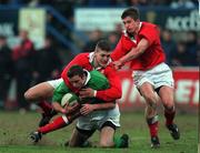 31 March 2000; Geordan Murphy of Ireland is tackled by Delme Williams, left, and Paul John of Wales during the Six Nations A Rugby Championship match between Ireland and Wales at Donnybrook Stadium in Dublin. Photo by Matt Browne/Sportsfile