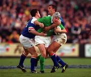 4 March 2000; Girvan Dempsey of Ireland is tackled by Cristian Stoica of Italy during the Lloyds TSB 6 Nations match between Ireland and Italy at Lansdowne Road in Dublin. Photo by Matt Browne/Sportsfile