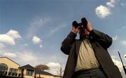 1 May 2000; A punter watches a race at The Curragh in Newbridge, Kildare. Photo by Brendan Moran/Sportsfile