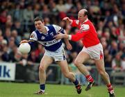 23 April 2000; Ian Fitzgerald of Laois is tackled by Stephen Melia of Louth during the Church & General National Football League Division 2 Semi-Final match between Louth and Laois at Cusack Park in Mullingar, Westmeath. Photo by Aoife Rice/Sportsfile