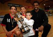 9 February 2000; St Fintan's coach Jerome Westbrooks, right, with his sons, Michael, left, who was MVP, Isaac, aged six, and Eric with the trophy following during the Bank of Ireland Schools Cup Boys' A Final match between St Fintan's Sutton and Colaiste Eanna at National Basketball Arena in Tallaght, Dublin. Photo by Brendan Moran/Sportsfile