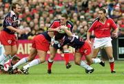 15 April 2000; John Kelly of Munster in action against Franck Comba and Christophe Dominici of Stade Francais during the Heineken Cup Quarter-Final match between Munster and Stade Francais at Thomond Park in Limerick. Photo by Matt Browne/Sportsfile