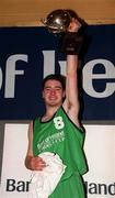 9 February 2000; The Colaiste Mhuire Crosshaven captain Jonathan Fitzgibbon lifts the trophy following the Bank of Ireland Schools Cup Boys' C Final match between Colaiste Mhuire Crosshaven and Carrick-On-Shannon CS at National Basketball Arena in Tallaght, Dublin. Photo by Brendan Moran/Sportsfile