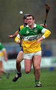 2 April 2000; Kevin Martin of Offaly in action against Gerry Quinn of Clare during the Church & General National Hurling League Division 1A Round 5 match between Offaly and Clare at St Brendan's Park in Birr, Offaly. Photo by Damien Eagers/Sportsfile