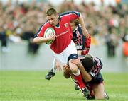 15 April 2000; Killian Keane of Munster in action against David Auradou of Stade Francais during the Heineken Cup Quarter-Final match between Munster and Stade Francais at Thomond Park in Limerick. Photo by Brendan Moran/Sportsfile