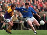9 April 2000; Larry Reilly of Cavan in action against Colm Morris of Wexford during the Church & General National Football League Division 2B Round 7 match between Wexford and Cavan at O'Kennedy Park in New Ross, Wexford. Photo by Matt Browne/Sportsfile
