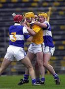 8 April 2000; Liam Cahill of Tipperary in action against Bill Maher, left, and Cyril Cuddy of Laois during the Church & General National Hurling League Division 1B Round 6 match between Tipperary and Laois at Semple Stadium in Thurles, Tipperary. Photo by Damien Eagers/Sportsfile