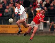 5 March 2000; Mark McNeill of Armagh in action against Don Davis of Cork during the Church & General National Football League Division 1A Round 5 match between Armagh and Cork at Crossmaglen Rangers GAC Club in Armagh. Photo by Damien Eagers/Sportsfile