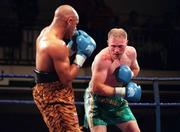 15 April 2000; Michael Carruth, right, and Adrian Stone during their IBO Middleweight Championship title fight at York Hall in Bethnal Green, England. Photo by David Maher/Sportsfile