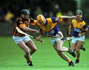 9 April 2000; Michael Jordan of Wexford is tackled by Sean Meally of Kilkenny during the Church & General National Hurling League Division 1B match between Wexford and Kilkenny at O'Kennedy Park in New Ross, Wexford. Photo by Matt Browne/Sportsfile