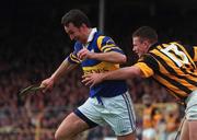 26 March 2000; Michael Ryan of Tipperary in action against Niall Moloney of Kilkenny during the Church & General National Hurling League Division 1B Round 4 match between Tipperary and Kilkenny at Semple Stadium in Thurles, Tipperary. Photo by Ray Lohan/Sportsfile