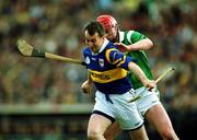 30 April 2000; Michael Ryan of Tipperary in action against Brian Begley of Limerick during the Church & General National Hurling League Division 1 Semi-Final match between Tipperary and Limerick at Semple Stadium in Thurles, Tipperary. Photo by Ray McManus/Sportsfile