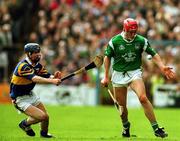 30 April 2000; Ollie Moran of Limerick in action against Mark O'Leary of Tipperary during the Church & General National Hurling League Division 1 Semi-Final match between Tipperary and Limerick at Semple Stadium in Thurles, Tipperary. Photo by Damien Eagers/Sportsfile