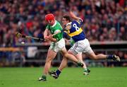 30 April 2000; Andy Moloney of Tipperary in action against Ollie Moran of Limerick during the Church & General National Hurling League Division 1 Semi-Final match between Tipperary and Limerick at Semple Stadium in Thurles, Tipperary. Photo by Ray McManus/Sportsfile