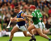 30 April 2000; Paul Shelley of Tipperary in action against TJ Ryan and Stephen McDonagh of Limerick during the Church & General National Hurling League Division 1 Semi-Final match between Tipperary and Limerick at Semple Stadium in Thurles, Tipperary. Photo by Damien Eagers/Sportsfile