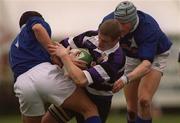15 April 2000; Peter O'Malley of Terenure is tackled by John McWeeney, left, and Malcolm O'Kelly of St Mary's College during the AIB All-Ireland League Division 1 match between Terenure and St Mary's College at Lakelands Park in Terenure, Dublin. Photo by Damien Eagers/Sportsfile