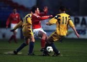 4 April 2000; Richie Baker of Shelbourne in action against Colm Murphy, left, and Colm Foley of Drogheda during the Eircom League Premier Division match between Shelbourne and Drogheda United at Tolka Park in Dublin. Photo by Brendan Moran/Sportsfile