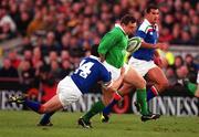 4 March 2000; Rob Henderson of Ireland is tackled by Juan Francesio of Italy during the Lloyds TSB 6 Nations match between Ireland and Italy at Lansdowne Road in Dublin. Photo by Brendan Moran/Sportsfile