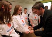 6 April 2000; Irelands Robbie Keane signs t-shirts of students as he promotes the FAI's new stadium Eircom Park at his former school St Aidan's Community College in Tallaght, Dublin. Photo by Matt Browne/Sportsfile