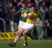 25 March 2000; Ronan Fitzsimons of Meath in action against Kenneth Mortimer of Mayo during the Church & General National Football League Division 1B Round 6 match between Meath and Mayo at Páirc Tailteann in Navan, Meath. Photo by Damien Eagers/Sportsfile