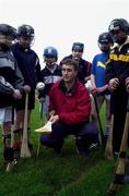 23 March 2000; Wexford hurler Rory McCarthy trains with pupils of Pobalscoil Bhuire in Gorey, Wexford. Photo by David Maher/Sportsfile