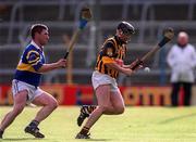 26 March 2000; Sean Mealy of Kilkenny in action against Paul Shelley of Tipperary during the Church & General National Hurling League Division 1B Round 4 match between Tipperary and Kilkenny at Semple Stadium in Thurles, Tipperary. Photo by Ray McManus/Sportsfile