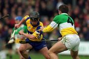2 April 2000; Sean Ryan of Clare in action against Colm Cassidy of Offaly during the Church & General National Hurling League Division 1A Round 5 match between Offaly and Clare at St Brendan's Park in Birr, Offaly. Photo by Aoife Rice/Sportsfile