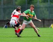 29 April 2000; Shane Hearty of Kerry in action against Colin McEndowney of Derry during the Church & General National Hurling League Division 1 Relegation Play-Off match between Kerry and Derry at Parnell Park in Dublin. Photo by Brendan Moran/Sportsfile