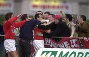 7 April 2000; Stephen Geoghegan of Shelbourne celebrates after scoring his side's first goal with team-mates and fans during the Eircom League Premier Division match between Waterford United and Shelbourne at Regional Sports Centre in Waterford. Photo by Matt Browne/Sportsfile