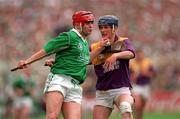 1 September 1996; TJ Ryan of Limerick in action against Colm Kehoe of Wexford during the Guinness All-Ireland Senior Hurling Championship Final match between Wexford and Limerick at Croke Park in Dublin. Photo by Ray McManus/Sportsfile