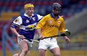 8 April 2000; Thomas Dunne of Tipperary in action against Cyril Cuddy of Laois during the Church & General National Hurling League Division 1B Round 6 match between Tipperary and Laois at Semple Stadium in Thurles, Tipperary. Photo by Ray McManus/Sportsfile