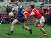 6 March 2000; Tommy Gill of Wicklow in action against Ray Rooney of Louth during the Church & General National Football League Division 1A Round 5 match between Wicklow and Louth at Aughrim County Ground in Wicklow. Photo by Matt Browne/Sportsfile
