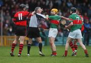18 November 2007; Referee Ambrose Heagney, Clare, steps in the restore peace as Adare players Brian Foley, 11, and Michael Noonan, 9, tussel with Paul Ormond, 4, and Tom King, 7, Loughmore-Castleiney. AIB Munster Senior Hurling Club Championship Semi-Final, Adare, Limerick v Loughmore-Castleiney, Tipperary, Gaelic Grounds, Limerick. Picture credit; Stephen McCarthy / SPORTSFILE