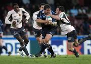 18 November 2007; Ollie Le Roux, Leinster, is tackled by Daan Human, right, and Omar Hasan, Toulouse. Heineken Cup, Pool 6, Round 2, Toulouse v Leinster, Toulouse, France. Picture credit; Matt Browne / SPORTSFILE *** Local Caption ***