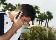 19 November 2007; Northern Ireland's Aaron Hughes, on the phone, after a press conference ahead of their 2008 European Championship Qualifier with Spain. Northern Ireland Press Conference, Riu Palace Hotel, Gran Canaria, Spain. Picture credit: Oliver McVeigh / SPORTSFILE