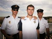 19 November 2007; Aaron Hughes, Northern Ireland, pictured with Spanish police after a press conference ahead of their 2008 European Championship Qualifier with Spain. Northern Ireland Press Conference, Riu Palace Hotel, Gran Canaria, Spain. Picture credit: Oliver McVeigh / SPORTSFILE