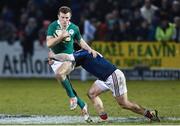 13 February 2015; Steven Fitzgerald, Ireland, is tackled by Camille Chat, France. U20's Six Nations Rugby Championship, Ireland v France, Dubarry Park, Athlone, Co. Westmeath. Picture credit: Ramsey Cardy / SPORTSFILE