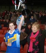 18 November 2007; Sinead Millea, Cashel, Tipperary, lifts the cup as Liz Howard, Uachtarán Chumann Camógaíochta na nGael, watches on. All-Ireland Senior Camogie Club Championship Final, Athenry, Galway v Cashel, Tipperary, Gaelic Grounds, Co. Limerick. Picture credit: Stephen McCarthy / SPORTSFILE