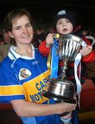 18 November 2007; Sinead Millea, Cashel, Tipperary, captain, with her nephew Aaron McEvoy, age 2, and the Bill  Carroll Cup after the match. All-Ireland Senior Camogie Club Championship Final, Athenry, Galway v Cashel, Tipperary, Gaelic Grounds, Co. Limerick. Picture credit: Stephen McCarthy / SPORTSFILE