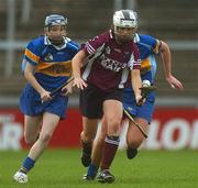 18 November 2007; Sarah Donohue, Athenry, Galway, in action against Alison Lonergan, left, and Linda Grogan, Cashel, Tipperary. All-Ireland Senior Camogie Club Championship Final, Athenry, Galway, v Cashel, Tipperary, Gaelic Grounds, Co. Limerick. Picture credit: Stephen McCarthy / SPORTSFILE